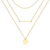 Layered gold necklace with fine chains, bar pendant and round disc charm
