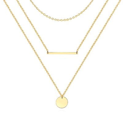 Layered gold necklace with fine chains, bar pendant and round disc charm