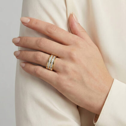 Gold wide band ring with three rows of square-cut clear crystals