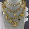 Gold curb chain necklace with multiple small crystal-set heart accents
