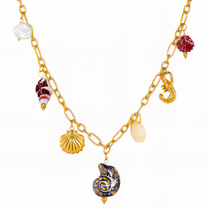 Gold charm necklace with mixed ocean motifs including nautilus, shrimp and shell charms