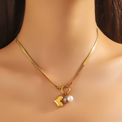 Gold herringbone chain necklace with heart charm, pearl bead and framed crystal drop