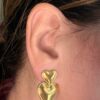 Double Love gold heart earrings in 18K gold plated stainless steel with double heart design