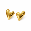 Gold stainless steel heart shaped statement earrings with shiny finish on white background
