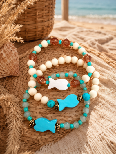 ChatGPT Image 20 mei 2026, 16_44_23 Set of 3 elastic bracelets with colorful acrylic beads and wooden fish charms in a beachy Ibiza style