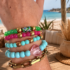 Soft Blue Bracelet Soft blue elastic bracelet with acrylic beads and gold accents styled on a neutral boho background