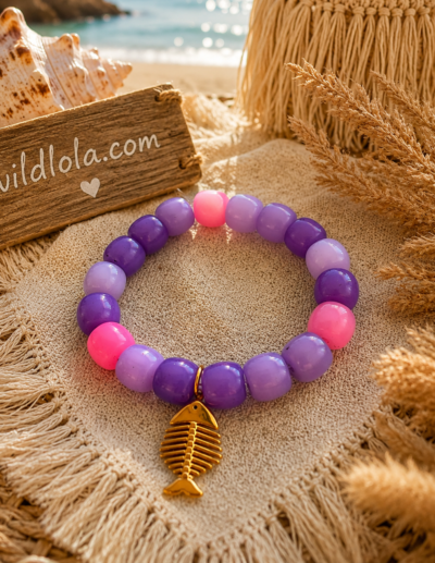 π Wild Lola Fishbone Bracelet Lavender Beach Handmade colorful acrylic bead bracelet with a gold fishbone charm displayed on a boho beach-inspired background.