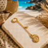 Golden Nautilus Bikini Charm Gold stainless steel nautilus shell bikini charm with crystal detail, waterproof beach accessory for bikinis and summer styling.