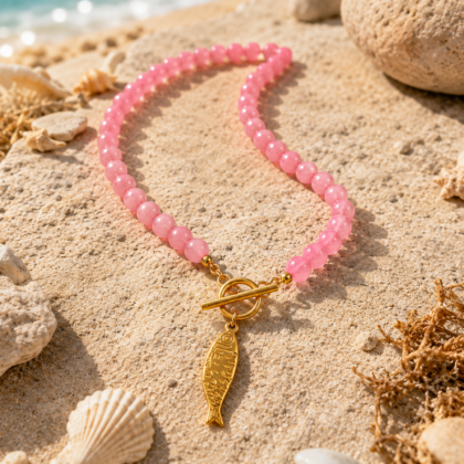 Colorful beaded necklace with gold-tone koi fish charms and toggle clasp.